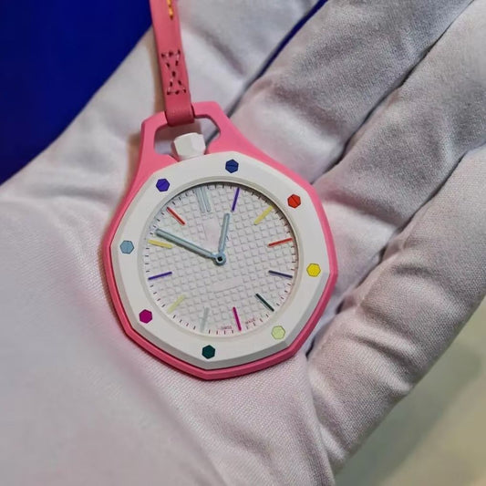 Royal Pop pink octagonal pocket watch with white bezel, multicolor hex screws and tapisserie dial on pink leather lanyard